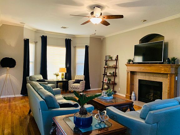Oversized living room with lots of natural light.