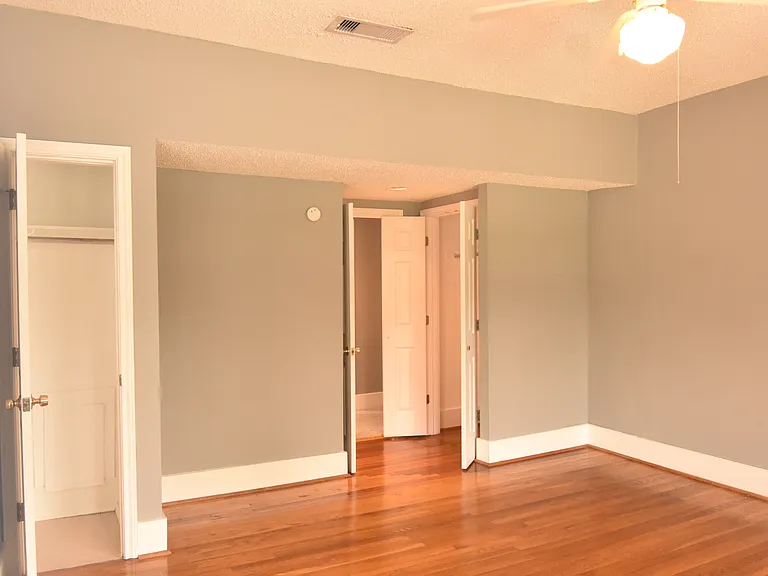 Additional view of primary bedroom with second closet