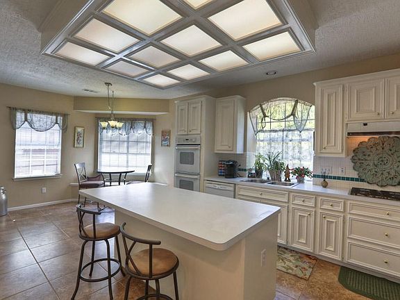 The Kitchen is extremely spacious has plenty of counterspace and so many cabinets for all of your cooking wares. The island is perfect for a grab-n-go snack for the family on the run.