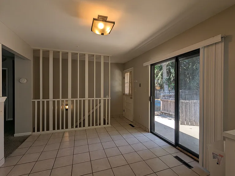 Kitchen area looking towards stairs to basement