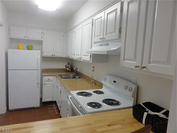 Galley kitchen with oven, dishwasher, pantry storage, brand