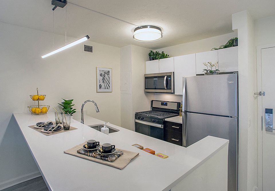 Open Kitchens feature Quartz Countertops and Breakfast Bar
