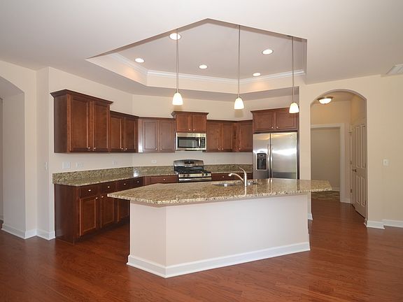 Hardwood Floors, Maple Cabinets, Granite Countertops & Stainless Steel Appliances are included in this Built & Ready to Deliver Home