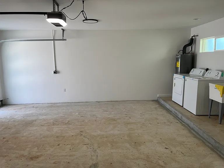Spacious two car garage with own laundry facilities