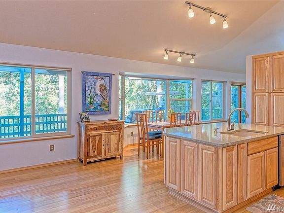 Dining area off kitchen offers lots of space. Bamboo floors & some built-ins.