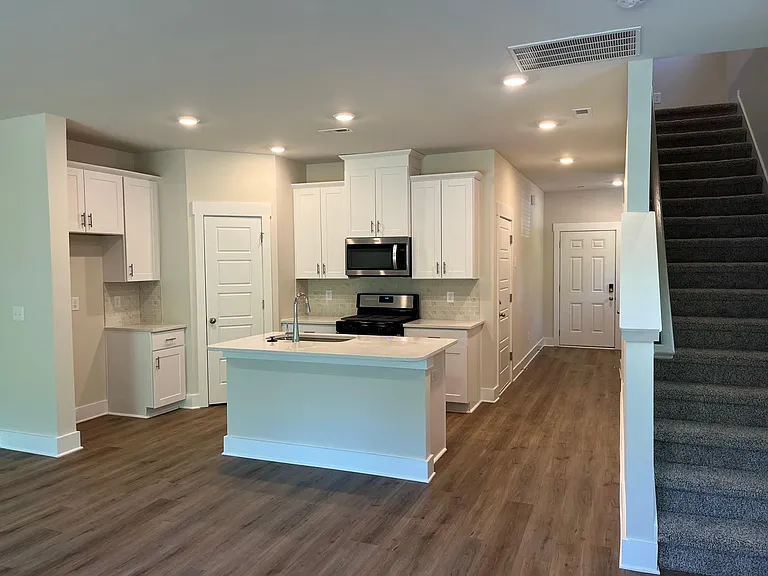 view from living space towards kitchen/front door