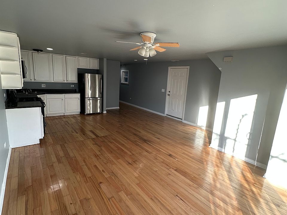 Open Concept Living Room and Kitchen Space - Front door on right of photo