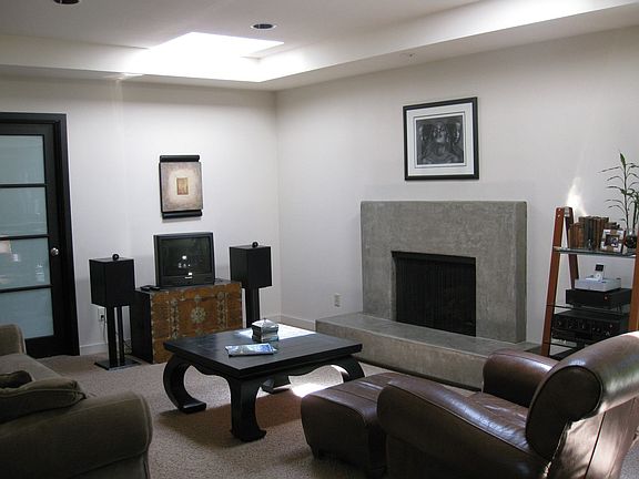 Family room with custom fireplace and two skylights
