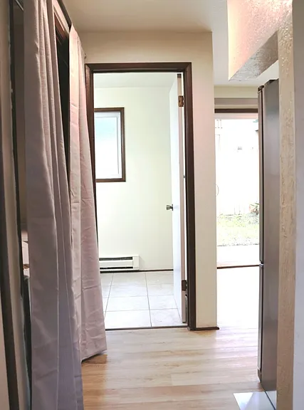 Looking toward kitchen at right and half bath in front.