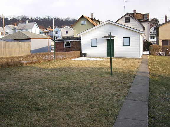 yard & walkway to 2 car garage