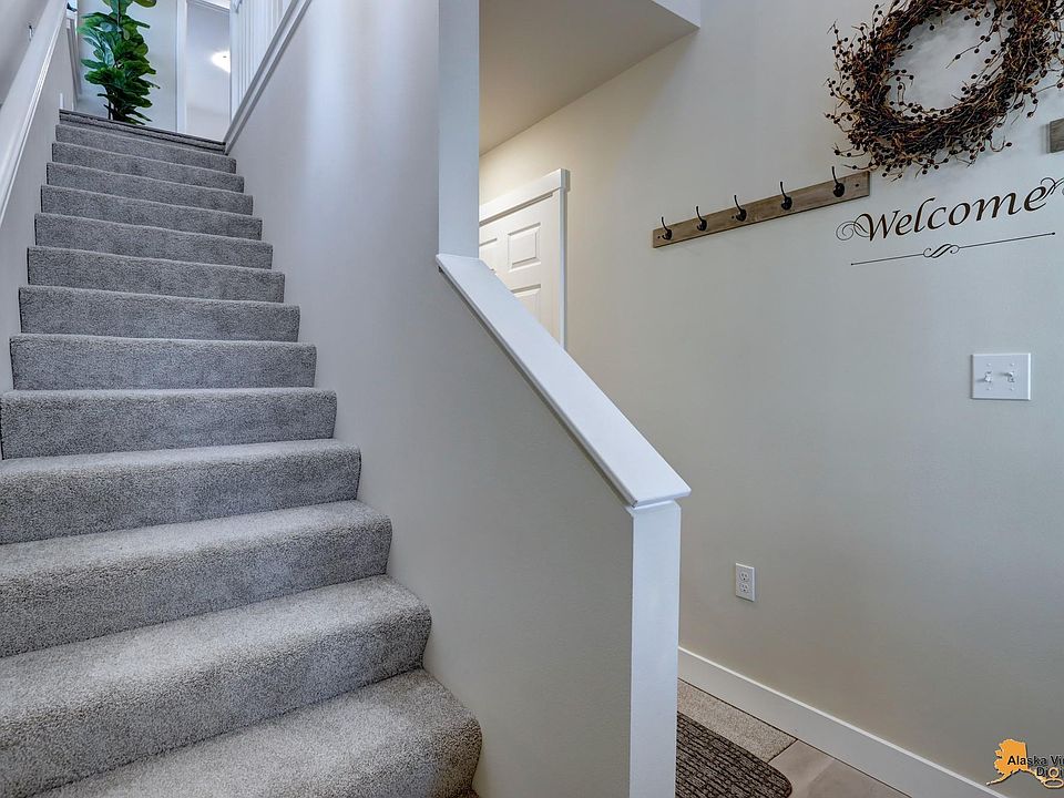 Steps to upper level; hall to lower level