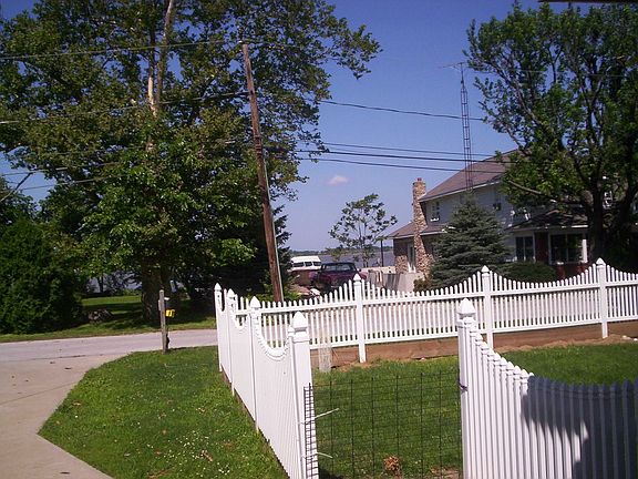 Lake view, concrete driveway, wood deck, new fencing, 1 block walk to parks