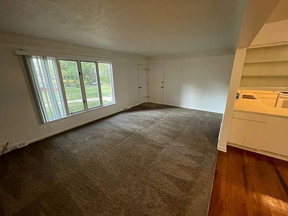 Living room and beginning of dining room & kitchen.