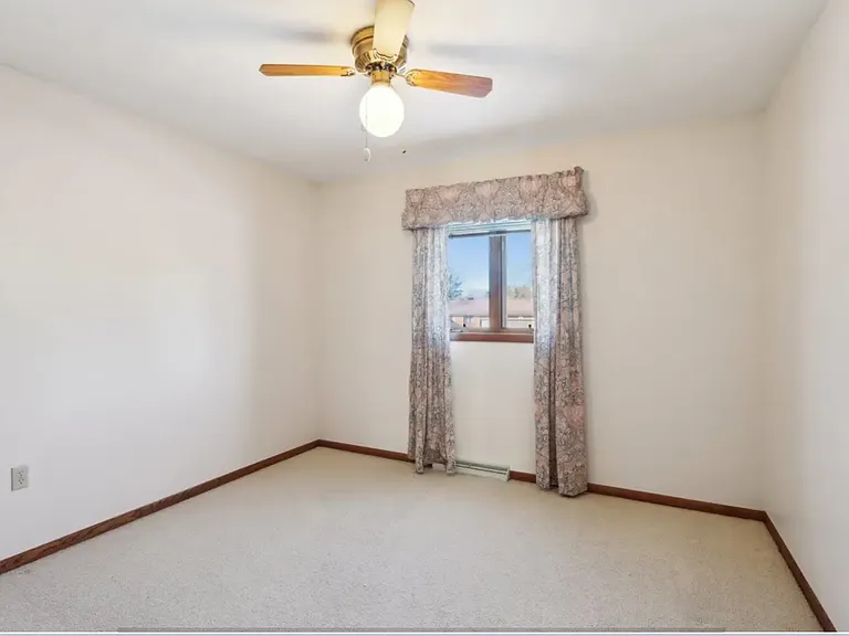 Bedroom 1. Curtains have been removed.