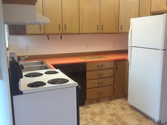 Kitchen with Dishwasher, Fridge, stove and disposal.