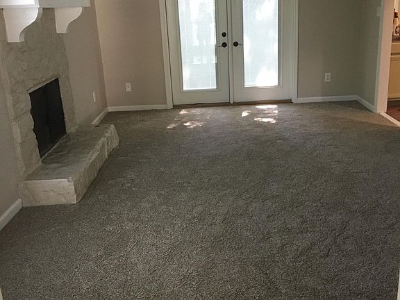 Den with French doors leading out to deck