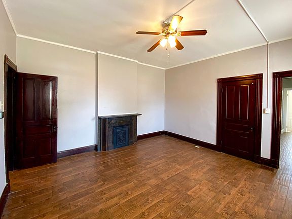 Large living room with closet space and smart thermostat.