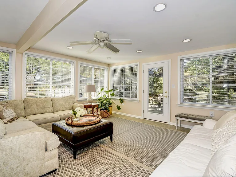 Four season sun room gets winter sun, summer shade. Baseboard electric heater and TV wall mount included.