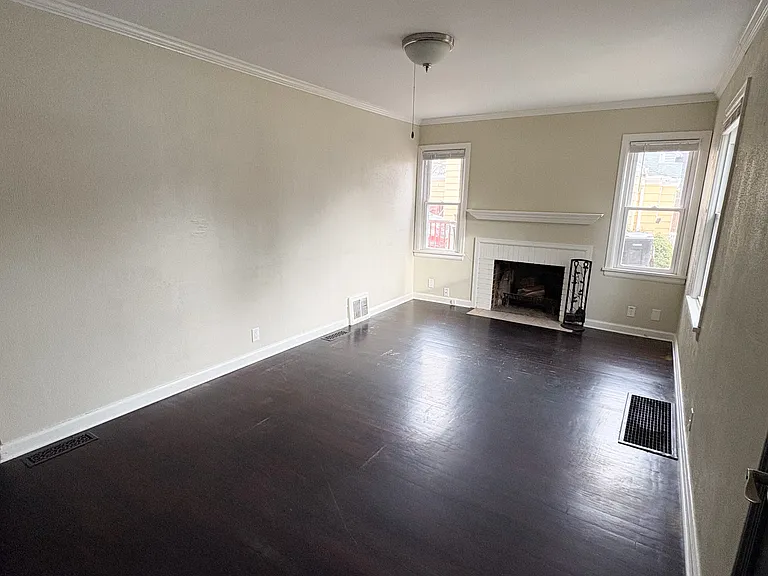 Living room with wood burning fireplace.