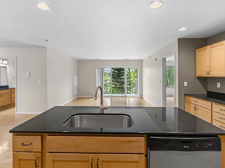 Elevate your lifestyle at Overlook Ridge with this beautifully designed kitchen, featuring sleek countertops and modern appliances. The open layout invites natural light, perfect for cooking and entertaining. Schedule your tour today!