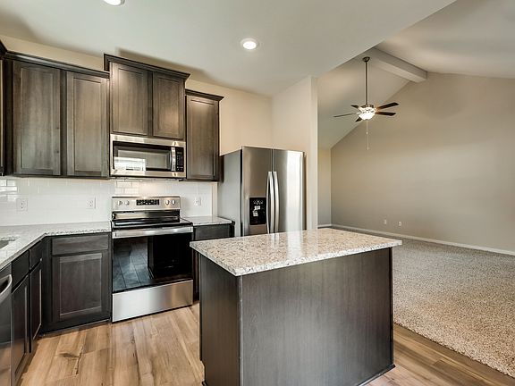 The kitchen comes with a full suite of stainless steel appliances