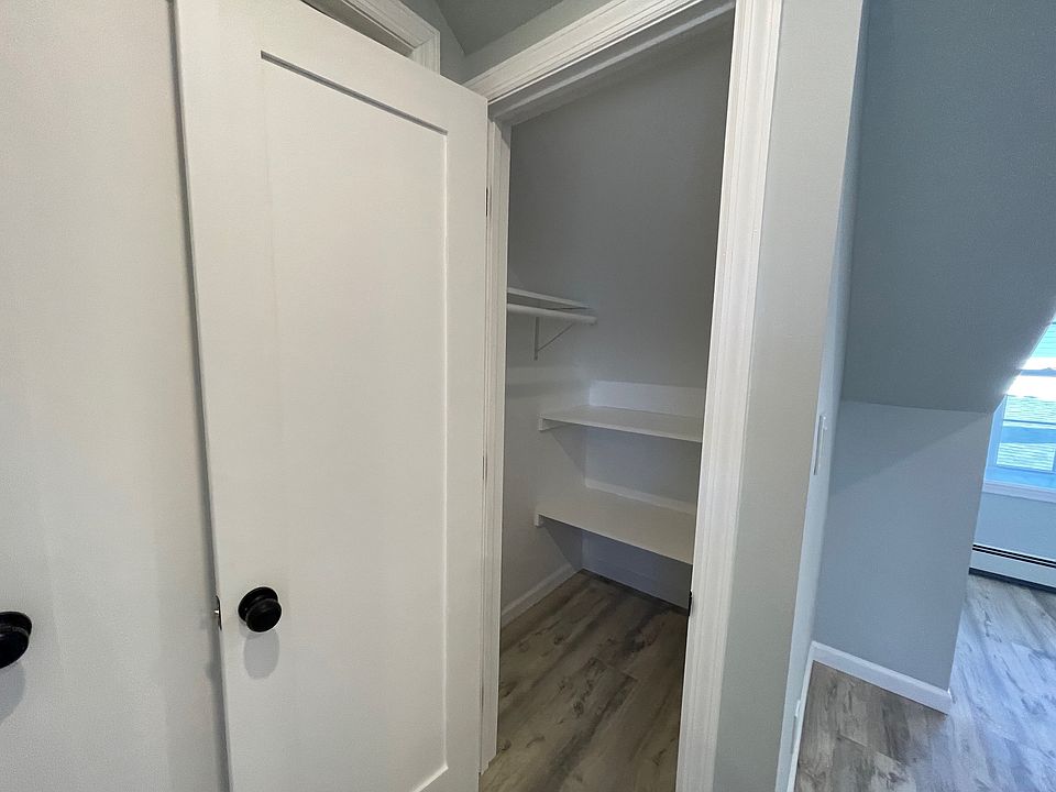 Large closet in the first bedroom with custom shelving perfect for keeping clothes, shoes, and accessories organized and easily accessible!
