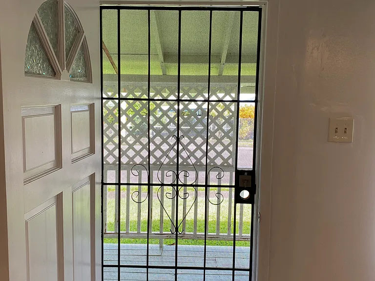 Steel metal door grill with deadbolt provides fresh air on hot days while keeping you secure
