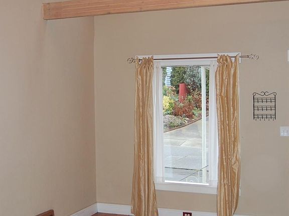 Main Living Room. 2 skylights (open/close feature) at ceiling