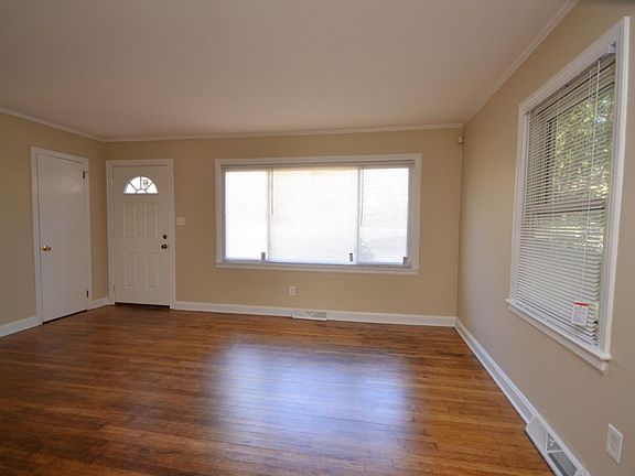 Living room with lots of windows and newly refinshed wood fl