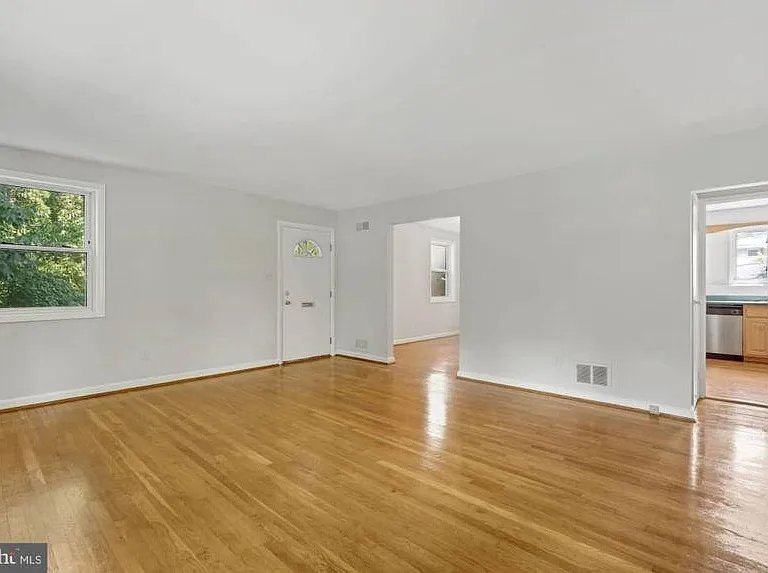 middle floor - living room - view of kitchen, dining room, and front door