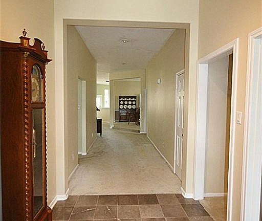 Wide, grand entrance is a rare find in a one-story!