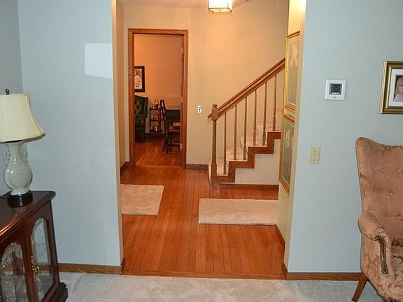 View from the living room of the foyer and the first floor office.  Notice the beautiful rich wood floors.