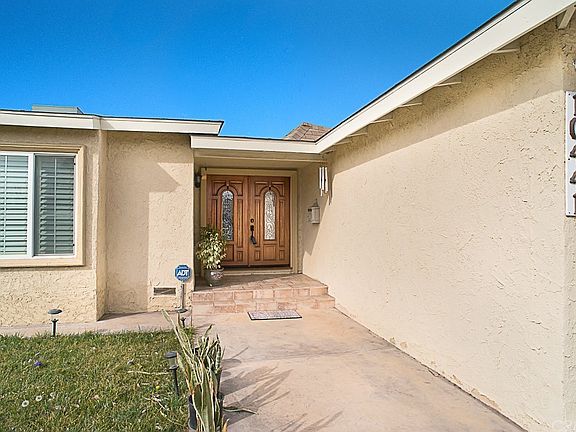 The inviting tiled front porch double door entry w