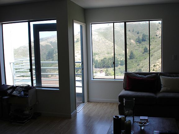 Balcony with a gorgeous view of the ocean and Mt. Tam