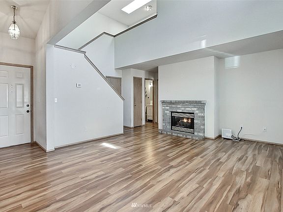 As you enter, you will find a dramatic 2-story family room with great flooring and beautiful gas fireplace. Skylights add even more light! 