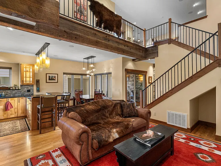 Open yet welcoming floor plan with hand hammered railing.