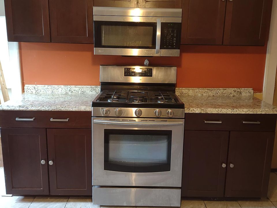 Kitchen with new tiles, counter tops and stainless appliances