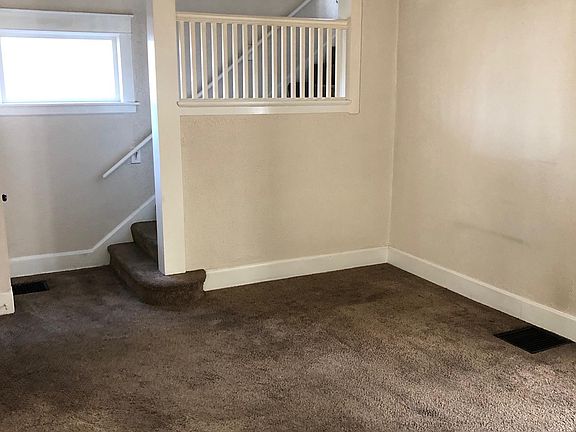Living Room with stairs going up.