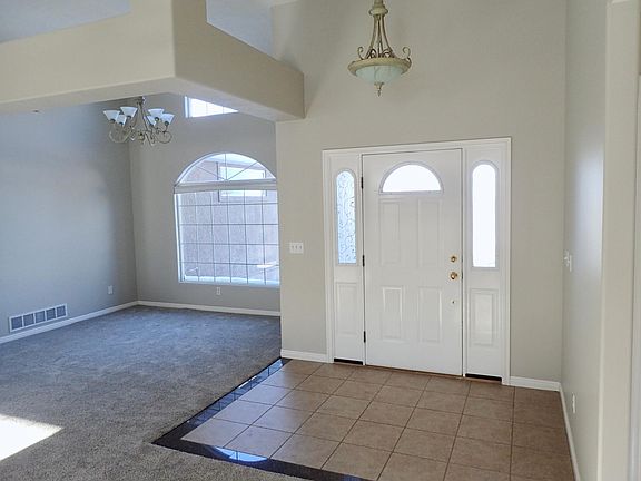 Entryway that leads into open concept dining, living and kitchen