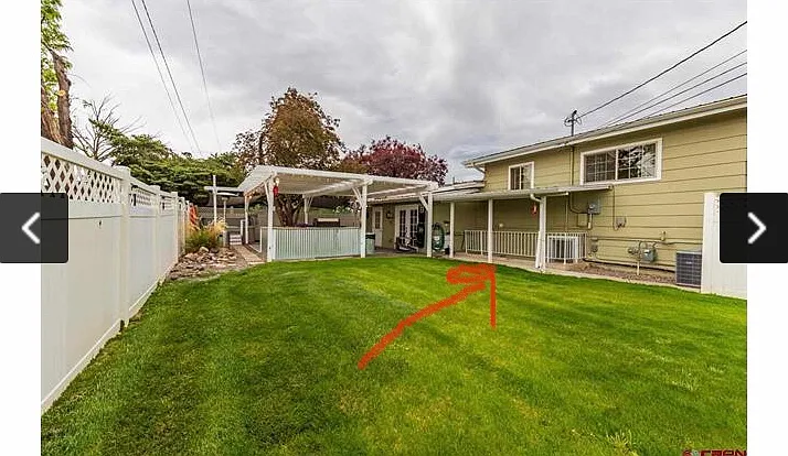 The arrow indicates the entrance to the garden level apartment.
