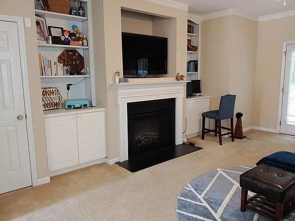 Family Room Fireplace with built in shelving & storage