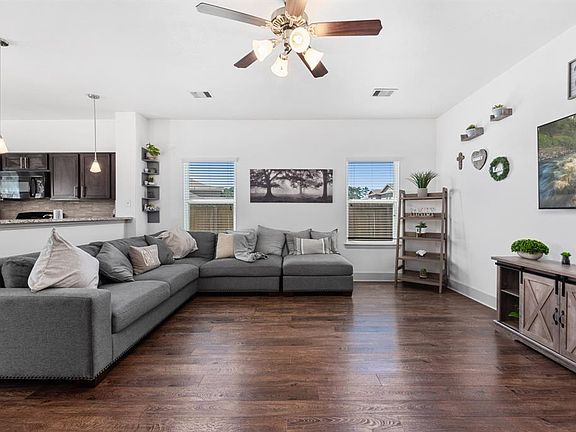 The large open family room and updated kitchen are at the center of this stylish home.