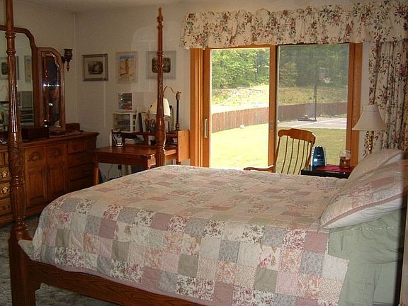 Master Bedroom with slider to patio/pool deck