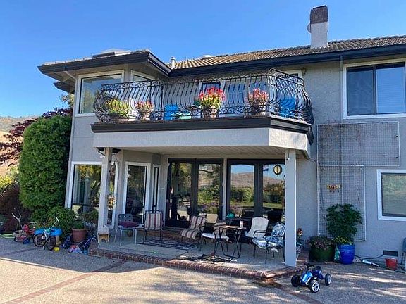 Rear side of the house going into an upper backyard