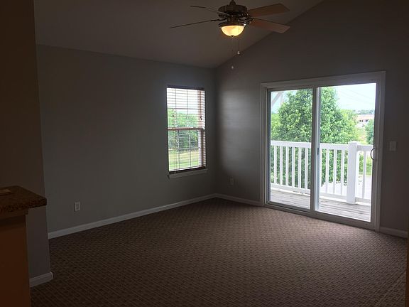 Great room walks out to covered deck.
