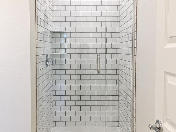 Master Bath w/ rain shower, modern glass entry and tile