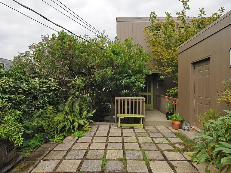 Super sweet courtyard, two car garage, and entrance to top unit.