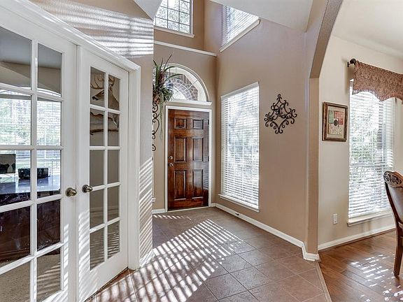 The view back towards the front door shows the inviting entry, open dining and convenient location of the study.