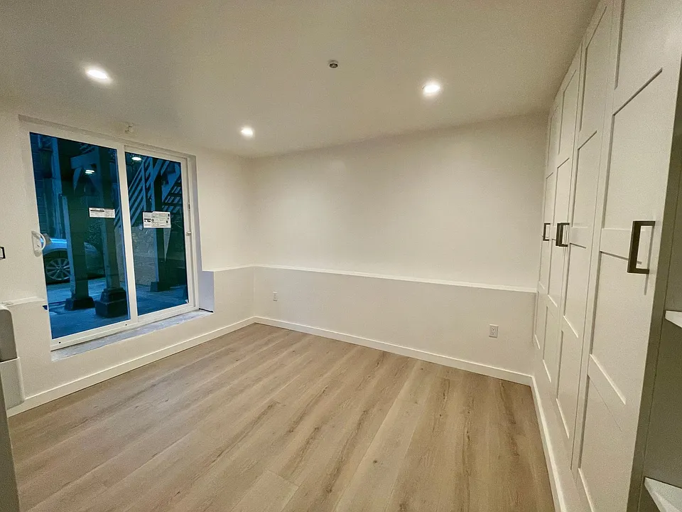 Bedroom with slider to yard