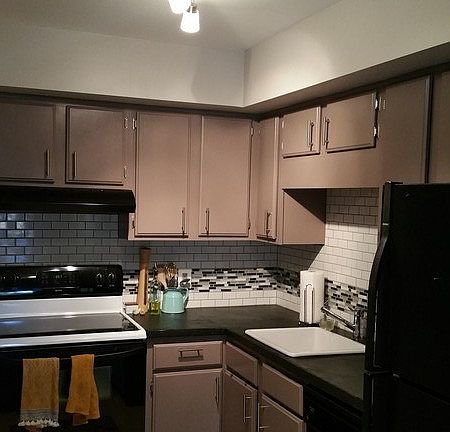 Updated Kitchen
						:
						Subway + glass tile, cement counters. Updated sink, faucet, hardware, & cabinets